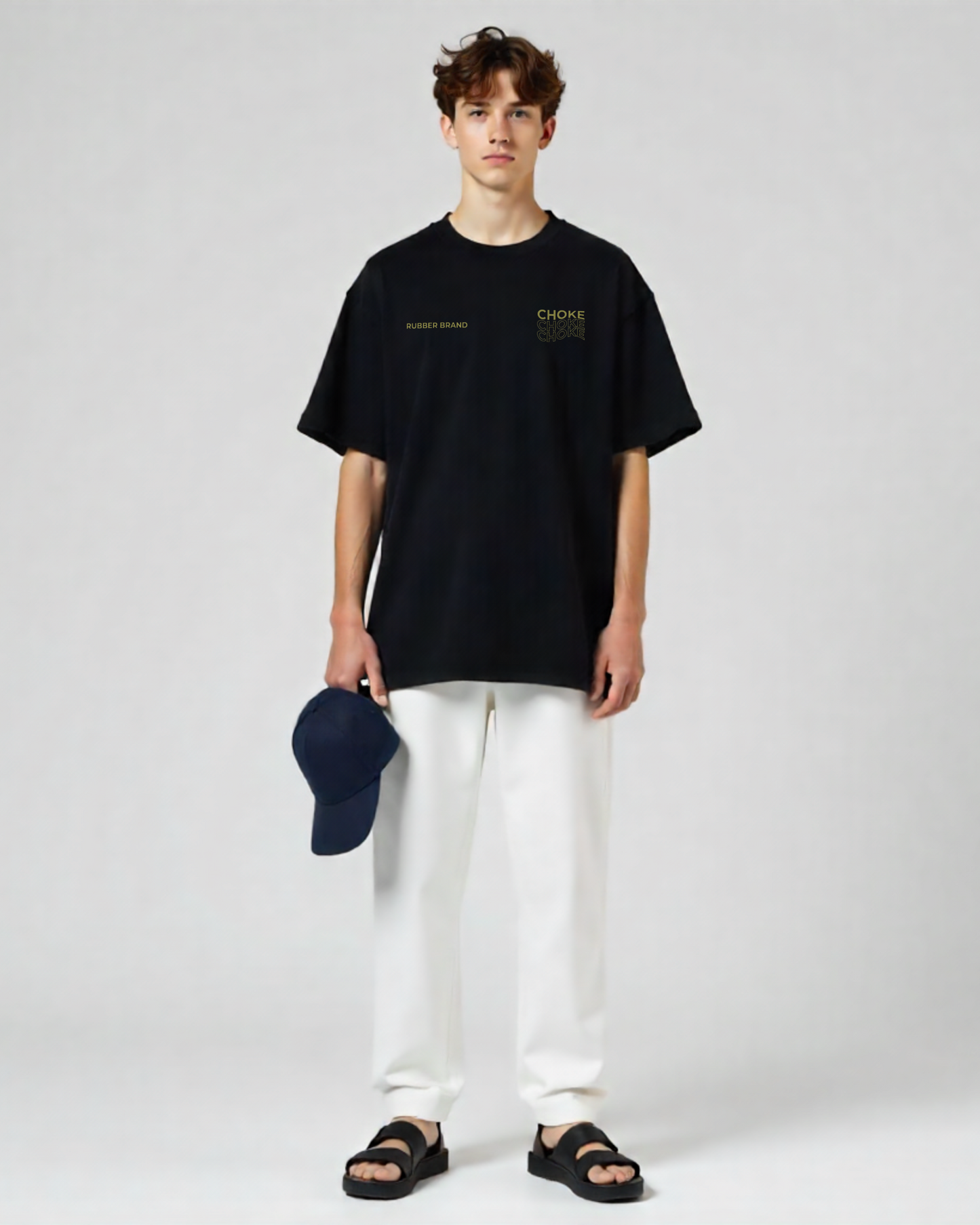 "Camiseta streetwear oversized color negra con diseño gráfico rubber brand."
