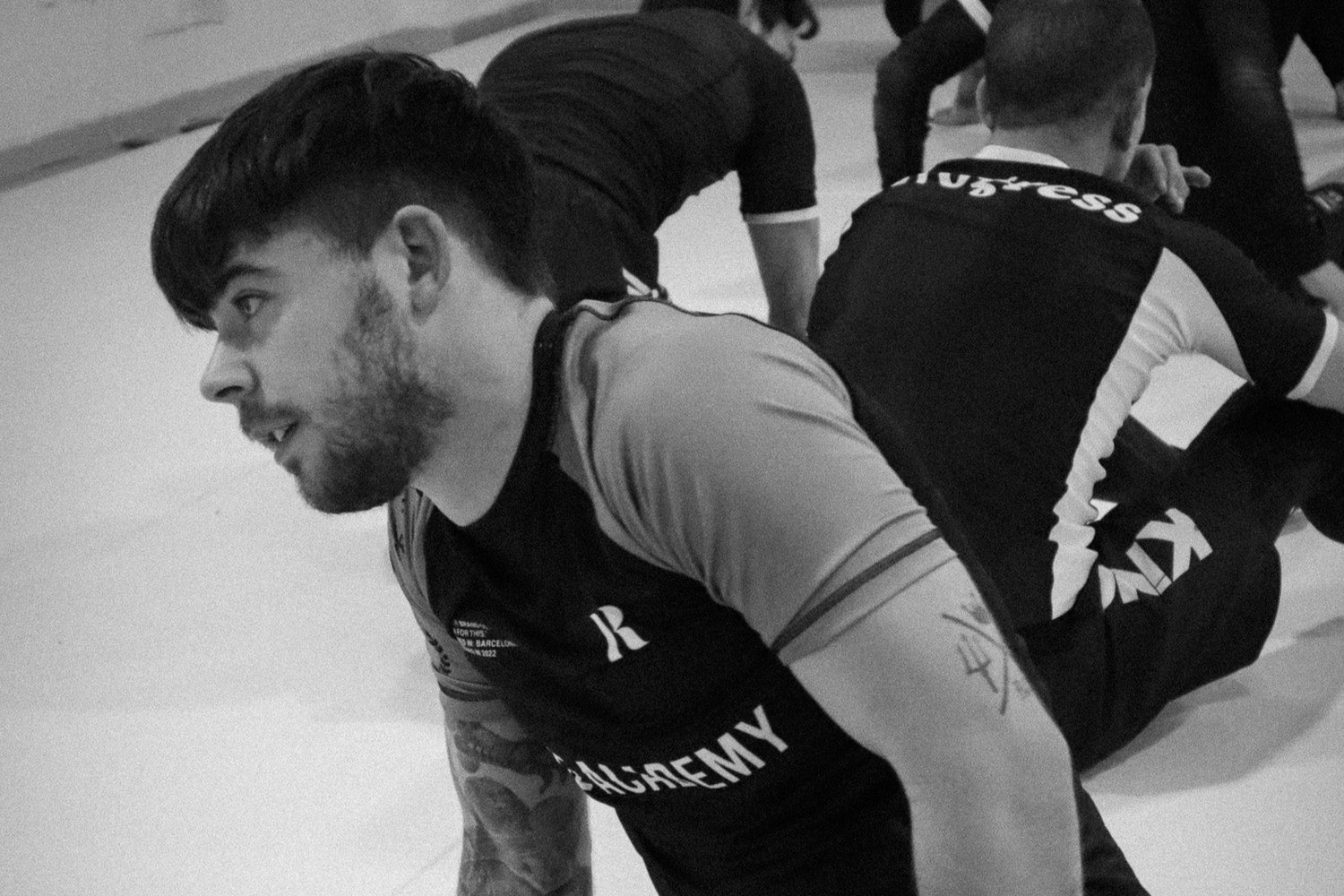 guy with a no gi rubber brand rash guard