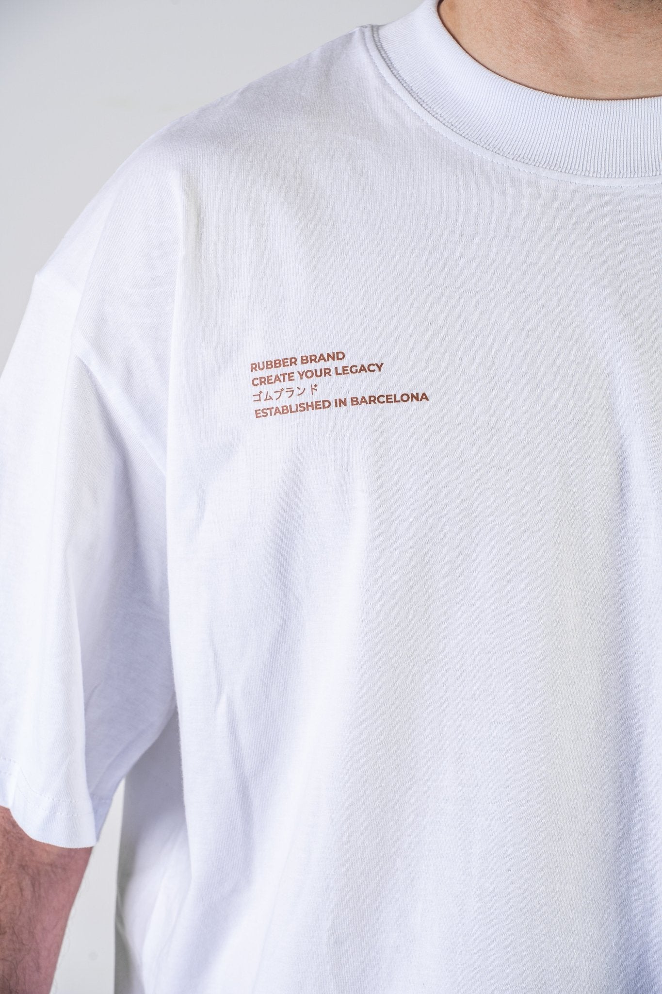 Camiseta "Create Your Legacy" blanca – Rubber Brand